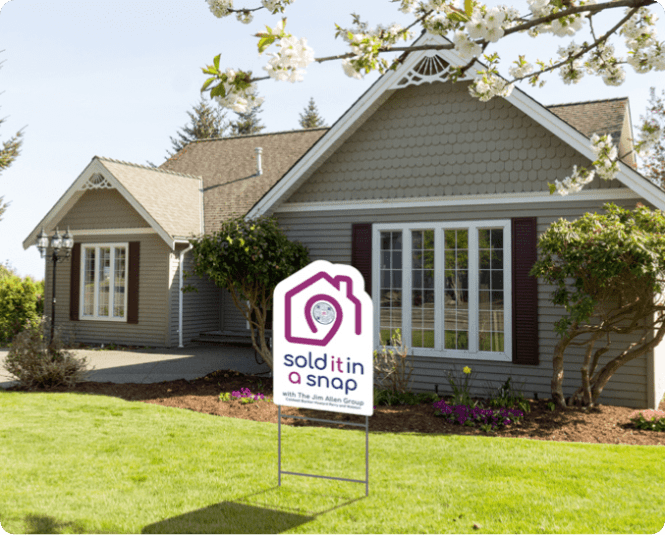 Suburban home with Sold It In A Snap real estate sign in front yard