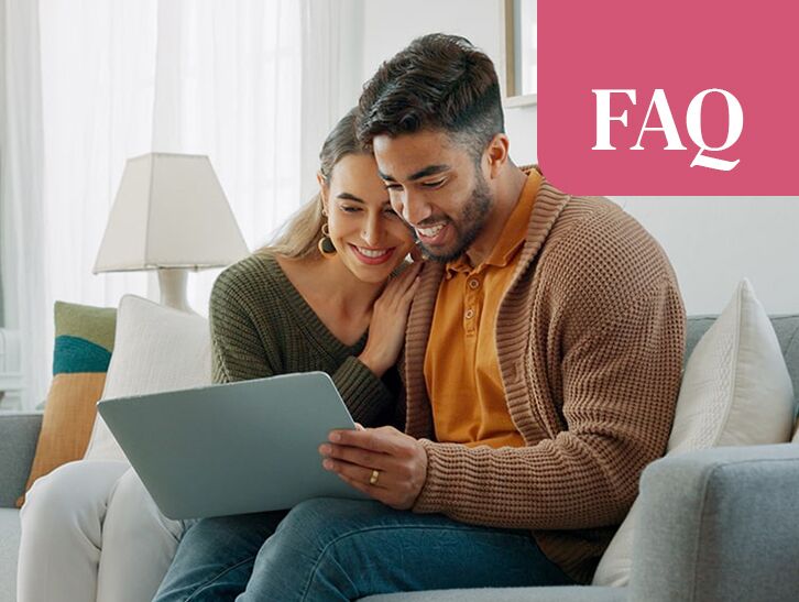Couple researching home buying or selling options online
