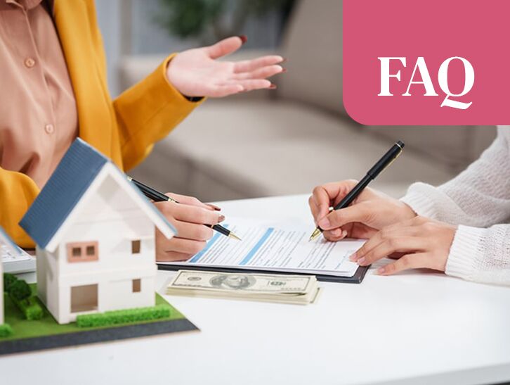 Client reviewing and signing home purchase documents with a real estate agent