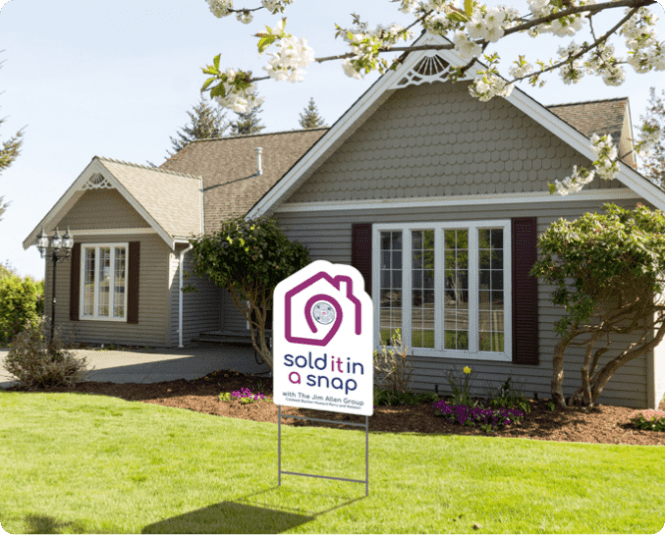Suburban home with Sold It In A Snap real estate sign in front yard
