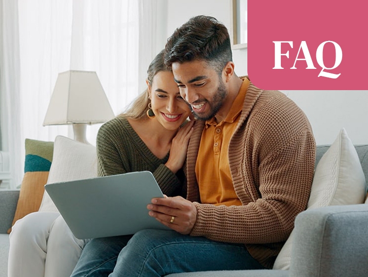 Couple researching home buying or selling options online